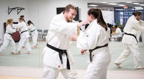 Two people practicing martial arts in Ann Arbor