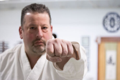 A man punching during martial arts in Ann Arbor