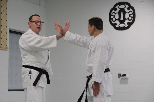 Two martial artists practicing martial arts in Ann Arbor